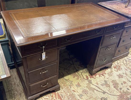 A mahogany pedestal desk fitted brown skiver, width 124cm, depth 70cm, height 75cm